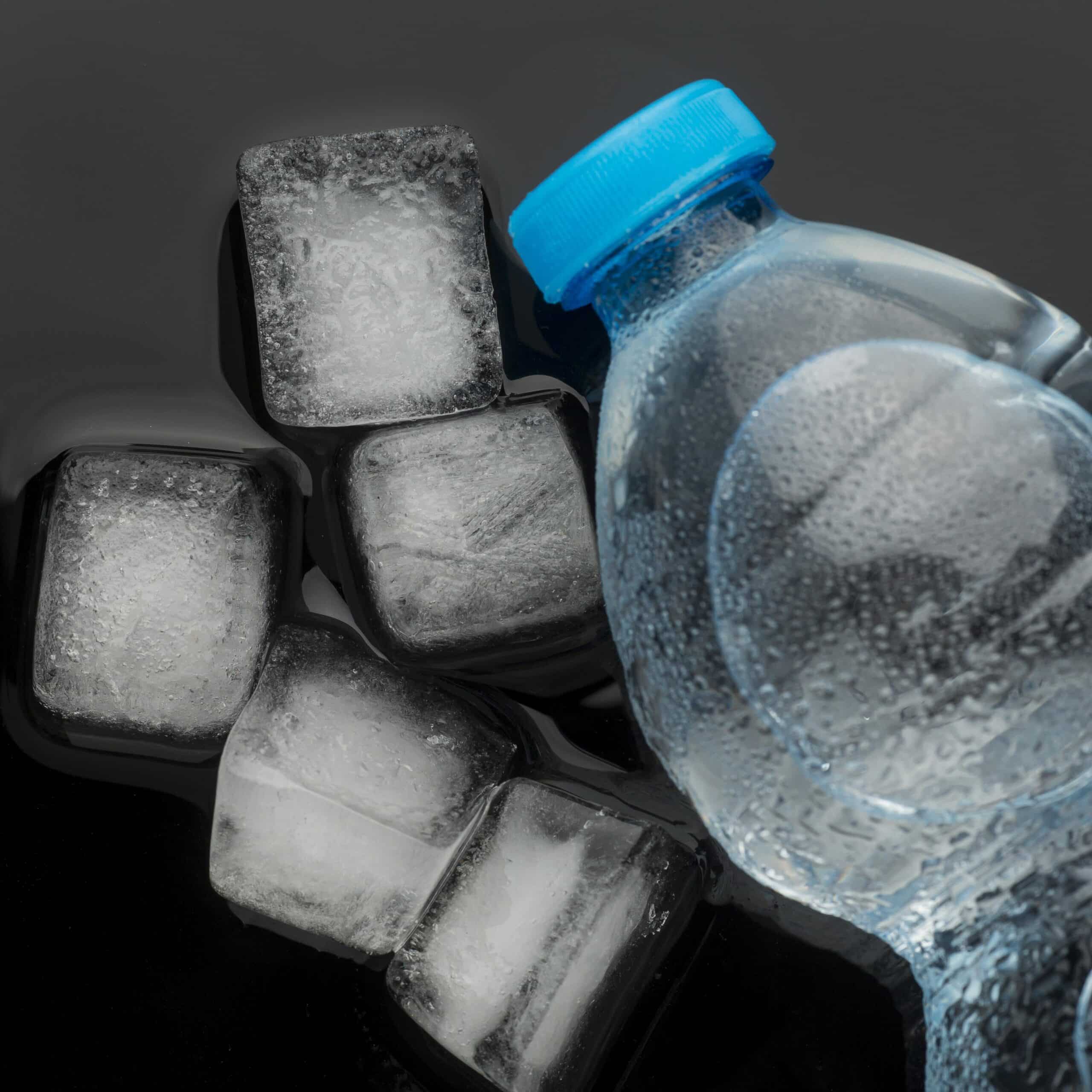 Ice cubes and water bottle top view, illustrating an LG refrigerator ice maker diagnosis