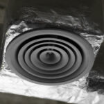 Close-up of a dryer vent duct, illustrating vent cleaning and fire safety