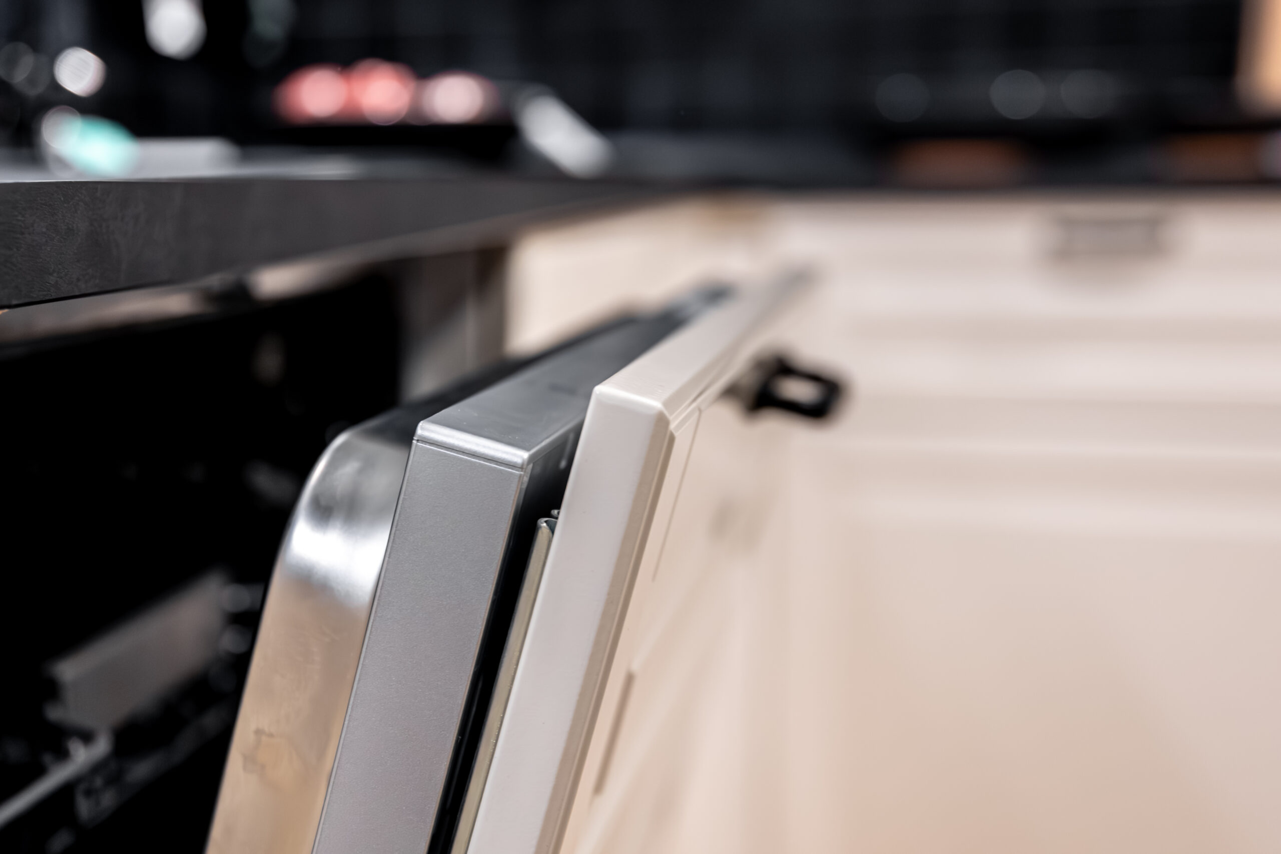 Close-up view of a dishwasher door and interior, illustrating a not-draining diagnosis