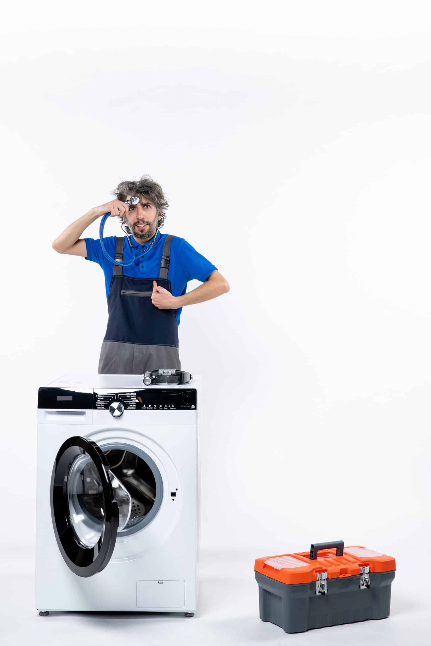 Repairman with a stethoscope standing next to a washing machine, illustrating Whirlpool washer error code F8 E1 low water flow