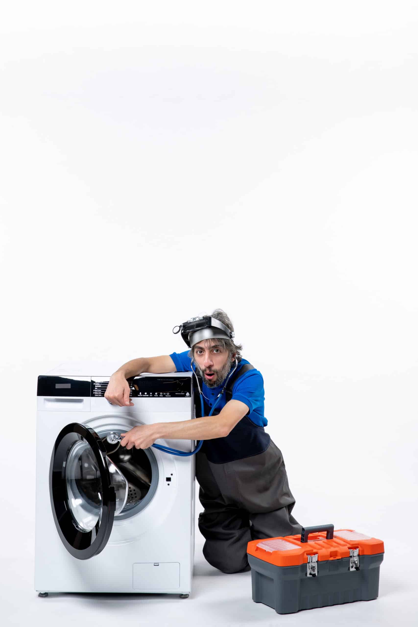 Repairman opening a tools bag next to a washing machine, illustrating Whirlpool washer error code F15 drum position sensor