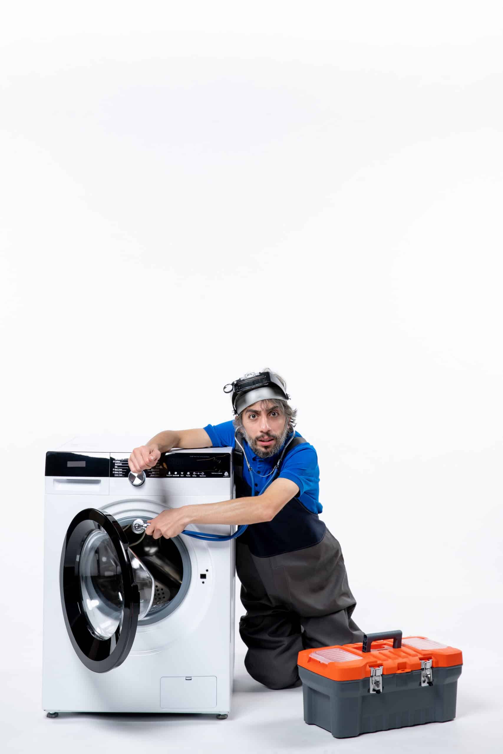 Repairman opening a washing machine, illustrating Maytag washer error code Sud excessive suds fault