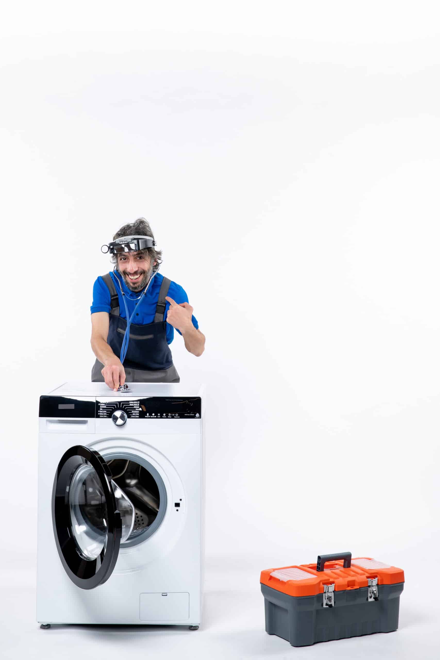 Young repairman with a head lamp using a stethoscope on a washing machine, illustrating Samsung washer error code 5C no drain fault