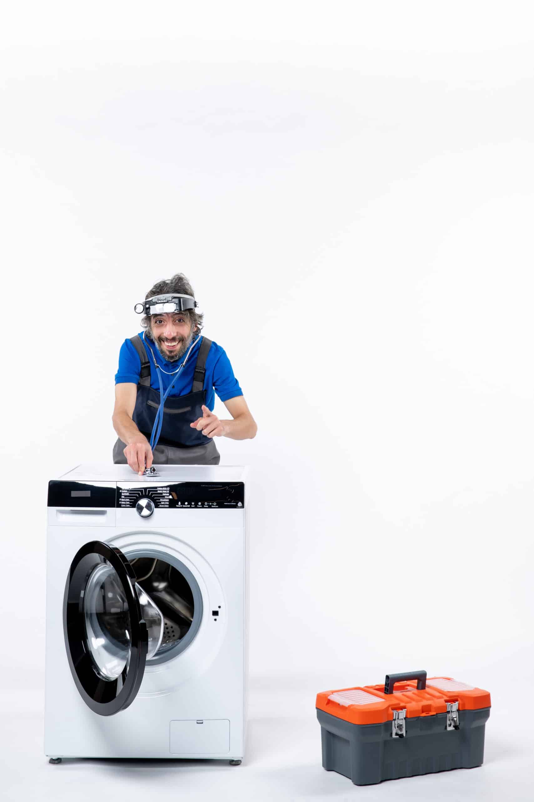 Repairman with a head lamp using a stethoscope on a washing machine, illustrating Samsung washer error code 4E not filling fault