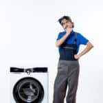 Repair technician standing near a washing machine with a tools bag, illustrating Frigidaire washer error code E2 drain fault