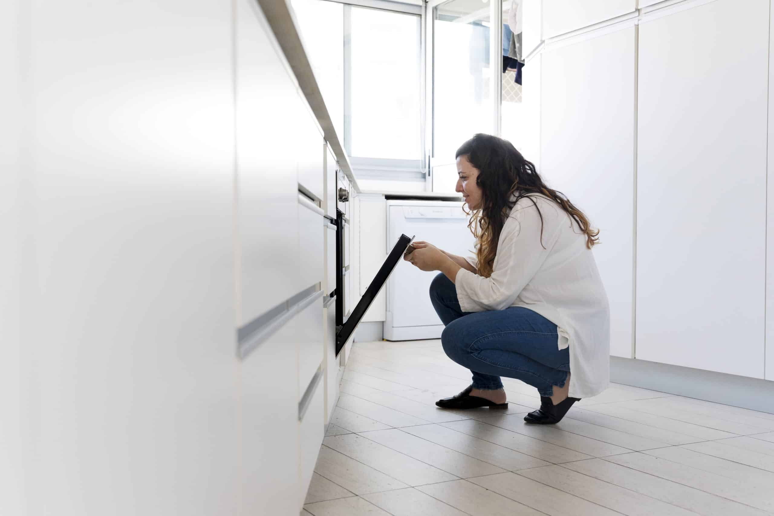 Open oven door, illustrating GE oven error code F9 door lock circuit fault