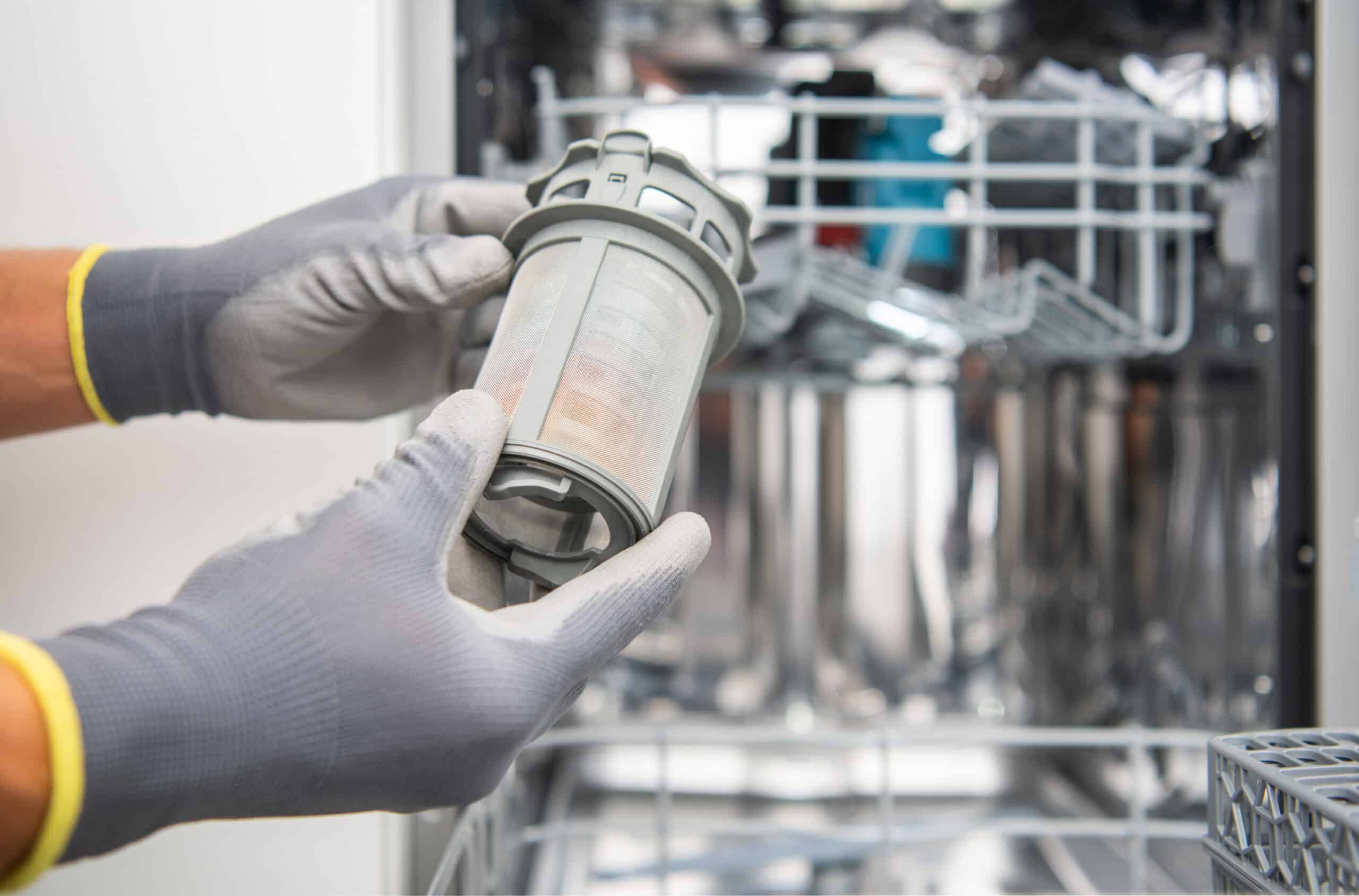 Technician checking a dishwasher that is not filling with water