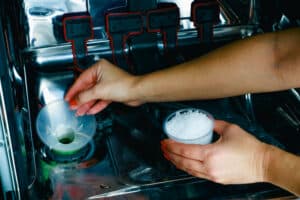 Pouring dishwasher salt to fix hard water white residue on dishes
