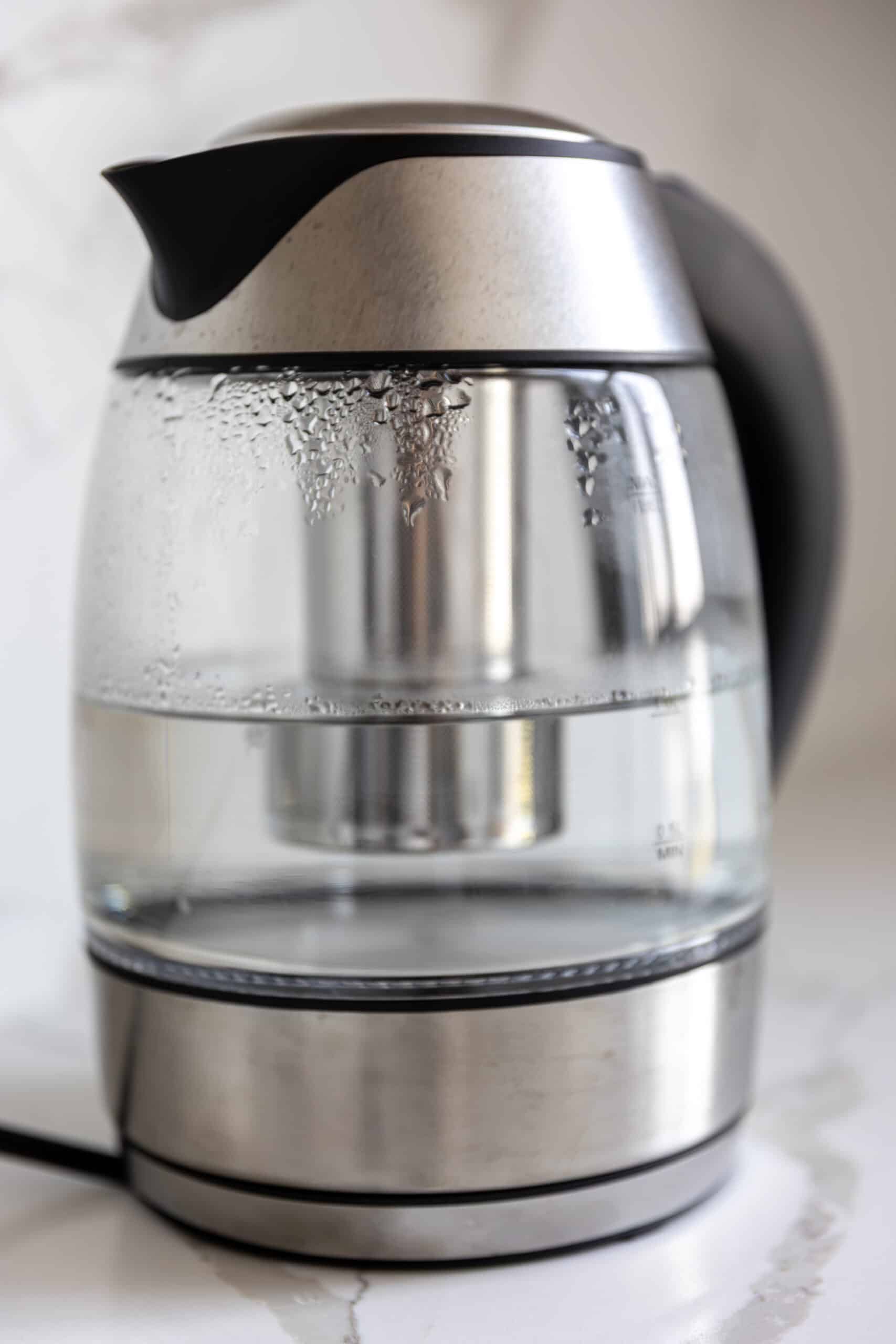 Hot water steam rising from a kitchen appliance, illustrating Whirlpool dishwasher error code F3 water heating fault