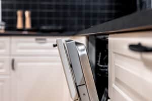 Built-in dishwasher door slightly open, unable to latch properly