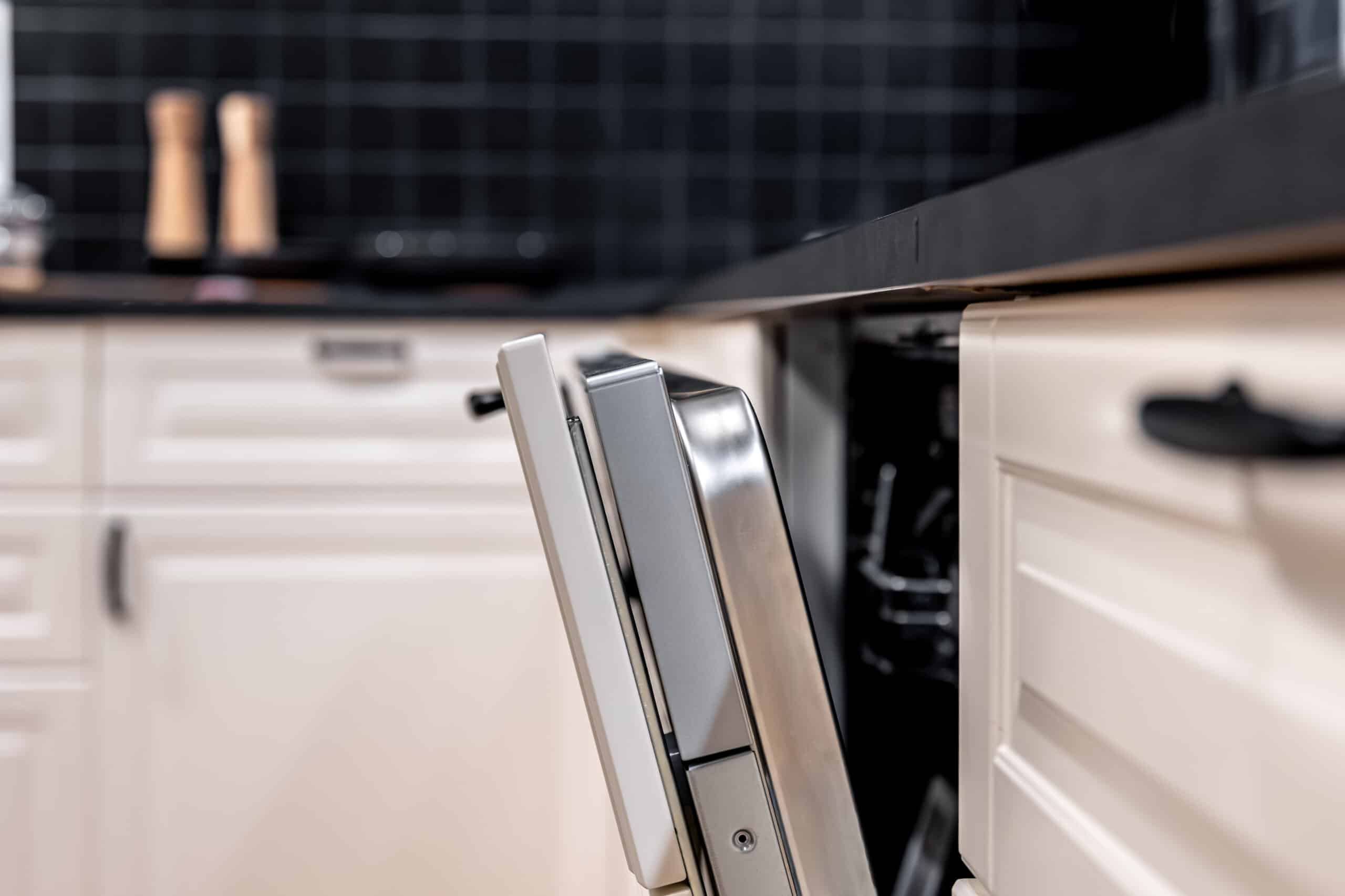 Built-in dishwasher door slightly open, unable to latch properly
