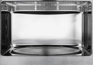 Close-up view inside a microwave cavity, illustrating sparking or arcing risk areas